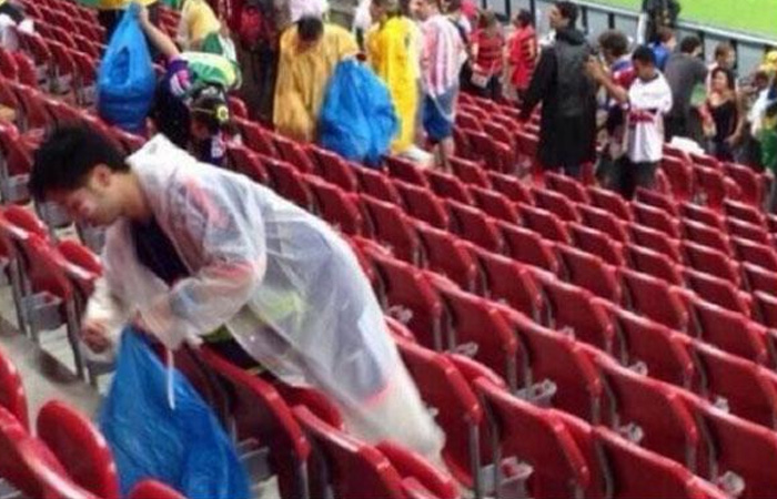 Japanese fans won plaudits around the world after picking up the trash in their stadium stand after World Cup game. (Google)