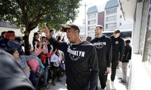 Rondae Hollis-Jefferson and some of his Nets teammates greeting fans in Mexico City on Wednesday. The Nets played two regular-season games there last week. (Photo: Rebecca Blackwell/Associated Press)