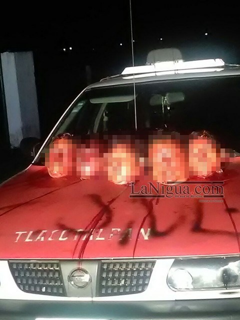 Five Heads Found on the hood of a taxi in Tlacotalpan, Veracruz (Photo: www.lanigua.com)